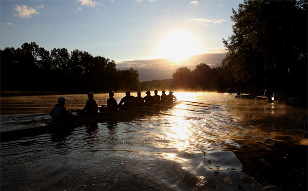 Rowers at sunset